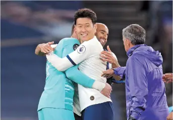  ??  ?? Tottenham Hotspur goalkeeper Hugo Lloris (left) celebrates with teammates Son Heung-min and Lucas Moura (back) after the 1-0 English Premier League victory over Everton at Tottenham Hotspur Stadium in London on Monday. — Reuters