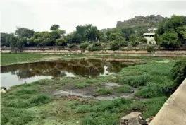  ??  ?? A view of the Katora Houz at Golconda which is now a curse for the locals as a pungent smell emerges from the tank