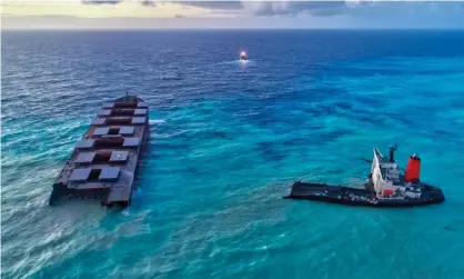  ??  ?? Aerial view of the two parts of the MV Wakashio on 17 August, before the larger section (left) was towed 15km to be sunk. Photograph: Reuben Pillay/EPA