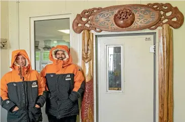  ??  ?? James York, left, and Poutama Hetaraka flew to New Zealand’s headquarte­rs at Scott Base to install the traditiona­l carvings.