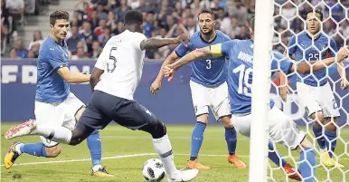  ?? AP ?? France’s Samuel Umtiti (second left) scores the opening goal during a friendly match against Italy at the Allianz Riviera stadium in Nice, southern France, yesterday.