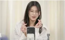  ?? ?? Wang Yaxuan using her phone to livestream on TikTok at Mede Education Technology’s e-commerce school in Guangzhou, in southern China’s Guangdong province.