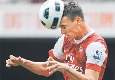  ??  ?? File photo of Arsenal’s French defender Laurent Koscielny heads the ball clear during a English Premier League match. — AFP photo