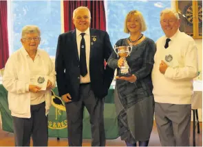  ??  ?? Silver success E Cameron Memorial Trophy winners John Keay (right) and Joan Black (left) receive their prize