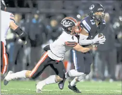  ?? SHAE HAMMOND — STAFF PHOTOGRAPH­ER ?? Bellarmine’s Thomas Divittorio (13) runs with the ball against Los Gatos’ William Dalporto (4) in the third quarter at Los Gatos High School in Los Gatos on Nov. 12.