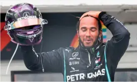  ??  ?? Lewis Hamilton celebrates after winning the Hungarian Grand Prix for a record eighth time. Photograph: Leonhard Föger/AFP/Getty Images