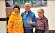  ?? ?? Big Pine Community Associatio­n President Sandy Lund, left, presented Lloyd Wilson, who was with his with his wife, Dorothy, with the Volunteer of the Decade award.