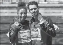  ?? ZOLTAN MATHE, THE ASSOCIATED PRESS ?? Jennifer Abel and François Imbeau-Dulac of Canada pose with their bronze medal won in the mixed three-metre synchro springboar­d final.