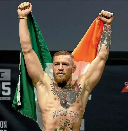  ??  ?? Conor McGregor celebrates beating Eddie Alvarez in a UFC lightweigh­t title bout last month.