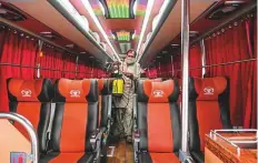  ?? AFP ?? A man disinfects a passenger bus in Lahore ahead of the
■ reopening of public transport as the lockdown is eased.