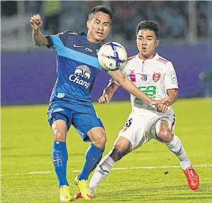  ??  ?? BEC’s Chanathip Songkrasin, right, in action against Chonburi.