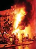  ?? — Reuters ?? Figures of a Fallas monument burn during the finale of the Fallas festival, in Valencia early on Wednesday.