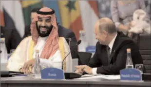  ?? -REUTERS ?? BUENOS AIRES
Saudi Arabia's Crown Prince Mohammed bin Salman (L) and Russia's President Vladimir Putin attend the G20 Leaders' Summit.