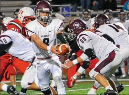  ?? DEBBY HIGH — FOR DIGITAL FIRST MEDIA ?? West Chester Henderson quarterbac­k Joe Saulino hands the ball off to Thaddeus Robuck Friday night at Upper Dublin.