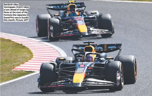  ?? ?? Red Bull’s Max Verstappen (front) takes a turn ahead of Sergio Perez at the start of the Formula One Japanese Grand Prix race in Suzuka this month. Picture: AFP