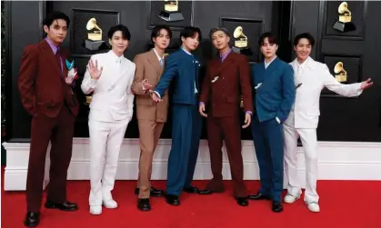  ?? Maria Alejandra Cardona/Reuters ?? The seven member of BTS will each serve almost two years in the military. The band is expected to reform in about 2025. Photograph:
