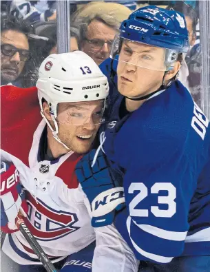  ?? KEVIN SOUSA NHLI ?? Toronto’s Travis Dermott checks Montreal’s Max Domi in October. If the playoffs were to start today, the Leafs would face off against the Canadiens — a fantasy matchup for the fan base.
