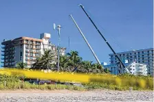  ?? MATIAS J. OCNER/MIAMI HERALD ?? Rescue workers continue to look through rubble for survivors at the partially collapsed condo building in Surfside, Fla., on Saturday. The remainder of the building will be demolished soon.