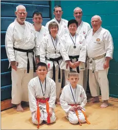  ??  ?? Wado Kai Group, back row left to right: Chris Bruce, Sandy Black, David Isaac, Mike Faulkner and Ronnie Watt. Middle: Julie Faulkner and Jane Bruce. Front, left to right: Jamie Summer and Nathan Isaac.