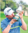  ?? AP ?? Bernd Wiesberger kisses the Italian Open trophy.