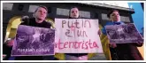  ?? ?? People demonstrat­e Monday outside the San Carlo opera house in Naples. The sign at center reads in Italian “Putin is a terrorist.”