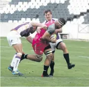  ??  ?? Morné Joubert and Duan Pretorius take on Ewart Potgieter.