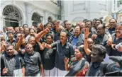  ?? — PTI ?? DMK working president M. K. Stalin, attired in black along with his party MLAs, stages a walkout from the Assembly in Chennai on Tuesday over their demand for “permanent closure” of the Vedanta group’s copper plant.