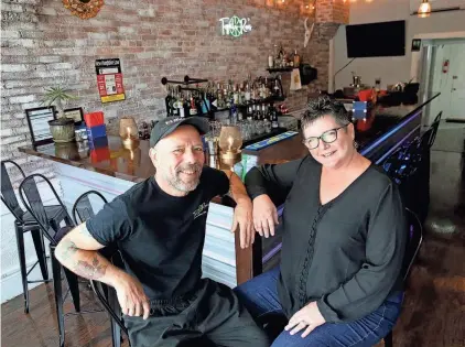  ?? DEB CRAM/SEACOASTON­LINE ?? Tequila Rae’s is the name of the new tapas bar and restaurant in downtown Newmarket. The establishm­ent is owned by Melani Rae Taillon and her husband Kevin, who are pictured at the bar.