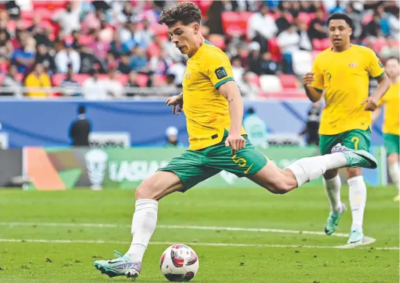  ?? ?? Defender Jordan Bos shoots on goal during the Socceroos Asian Cup Group B match against India, at Ahmad bin Ali Stadium, in Qatar. Picture: AFP