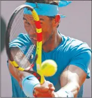  ?? AP/ALESSANDRA TARANTINO ?? Spain’s Rafael Nadal returns the ball to Argentina’s Juan Martin Del Potro on Friday at the Roland Garros stadium in Paris.