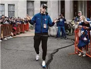  ?? Jessica Hill/Associated Press ?? UConn men's basketball Coach Dan Hurley greets fans during a parade to celebrate the team's NCAA college basketball championsh­ip, Saturday in Hartford.