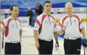  ?? Photo by Michael Burns ?? From left to right: Canada’s Brent Laing, Wayne Middaugh and skip Glenn Howard discuss their options during their 7-6 extra-end Page playoff win on Saturday.