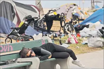  ??  ?? VENICE has as many as 2,000 people sleeping in tents, tarpaulin shacks, RVs and sometimes residents’ yards.