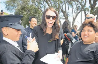  ?? Photo / Mark Mitchell ?? Jacinda Ardern took time to answer questions from children at the Rangitahi Village.