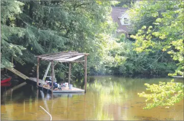  ?? ANN DAVIDSON ?? Constructi­on of stairs and dock on the banks of a branch of the Yamaska River in West Brome was underway last week as a film crew prepares to shoot a 12-episode series for TVA. The land that was recently purchased for over $1 million is located in a green zone.