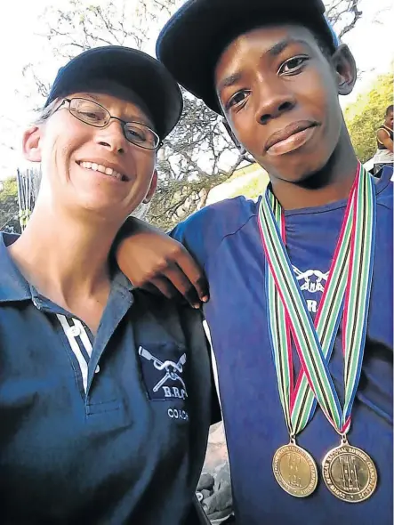  ?? Picture: SUPPLIED ?? BUDDING TALENT: Lukho Mbongisa of Duncan Village, right, who has been selected to the SA Junior Club rowing team, with his coach, Jean Ellingson, after the 2017 SA National Rowing Championsh­ips