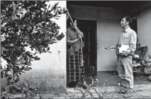  ??  ?? Attorney Juan Carlos Villatoro talks with a woman at her home as he looks for parents who may have been deported without their children.