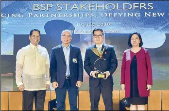  ??  ?? Shown in photo during the award ceremony are (from left) Monetary Board member Antonio Abacan Jr., Voyager Innovation­s president and CEO Orlando Vea, FINTQ managing director Lito Villanueva and BSP Deputy Governor Cyd Tuaño-Amador.