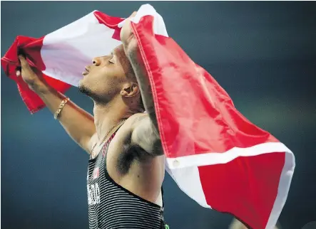  ?? TYLER ANDERSON FILES ?? Andre De Grasse, seen celebratin­g his bronze medal in the men’s 100-metre final at the Summer Olympics in Rio de Janeiro in August, is Postmedia’s male athlete of the year. The 22-year-old beat fellow Olympian Derek Drouin and NHL star Sidney Crosby.