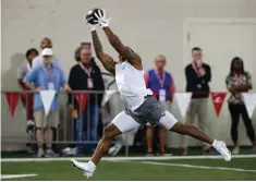  ?? Associated Press
Alonzo Adams, AP file photo ?? ■ Former Oklahoma running back Marcelias Sutton makes a catch as he runs through drills during Pro Day for NFL football scouts and coaches
on March 11 in Norman, Okla.