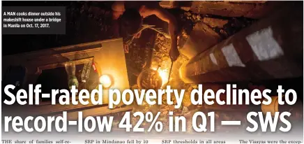  ??  ?? A MAN cooks dinner outside his makeshift house under a bridge in Manila on Oct. 17, 2017.