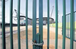  ?? AP ?? In this April 9, 2020 file photo, gates stand locked outside the closed Manchester City Etihad Stadium in Manchester, northern England, as the English Premier League football season has been suspended due to coronaviru­s.