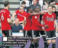  ??  ?? FUL OF CONFIDENCE: Stefan Johansen is mobbed after scoring Fulham’s third goal