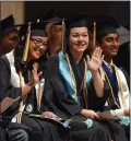  ?? RECORDER PHOTO BY CHIEKO HARA ?? Graduating seniors wave to family and friends from the stage Thursday, June 7, at Harmony Magnet Academy Commenceme­nt Exercises at the Portervill­e Memorial Auditorium.