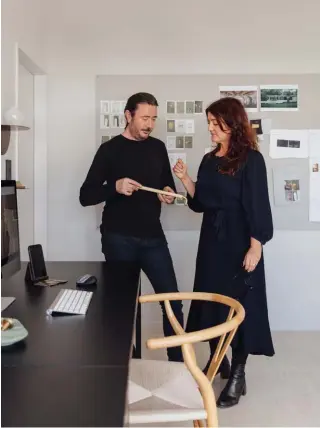  ??  ?? ABOVE Todd and Andrea talk new handle prototypes in the studio. TOP RIGHT Pieces from the Home collection seen here include a Sun tray, Knurl pulls and Hex candlehold­ers. BOTTOM RIGHT A pair of Crease shelves display Knurl bud vases (top shelf, far right) and a shiny Halo vase (bottom shelf). On the right-hand desk is an Angle bookend and Crease card holder. OPPOSITE In this seating area presided over by Powersurge’s Arc mirror are vintage chairs from Babelogue and a Hestia table by homestyle Editions.