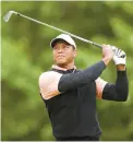  ?? AFP-Yonhap ?? Tiger Woods of the United States plays his shot from the 14th tee during the third round of the 2022 PGA Championsh­ip at Southern Hills Country Club in Tulsa, Oklahoma, Saturday.