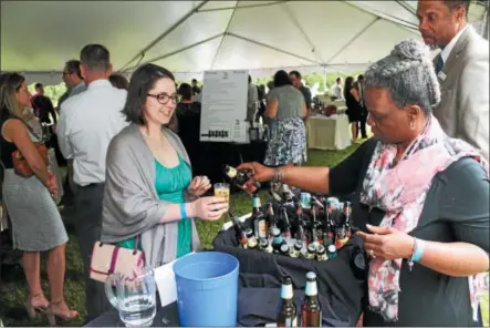  ?? PHOTO PROVIDED ?? Beer samples are poured at a previous Take a Sip for TRIP fundraisin­g event.