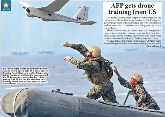  ?? ERNIE PEÑAREDOND­O ?? US Navy sailors launch an unmanned aerial vehicle from a speed boat off a naval base in Sangley Point, Cavite during the Cooperatio­n          	 
  	

   
          	 	   
	
       the Philippine Navy yesterday. Part of the six-day CARAT will involve...