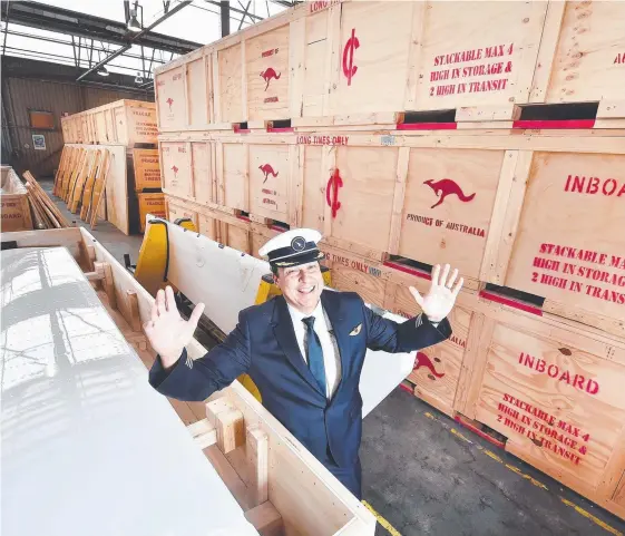  ?? Picture: ROB LEESON ?? Captain Alex Passerini with the first shipment of Melbourne-built parts for the Qantas 787 Dreamliner aircraft.
