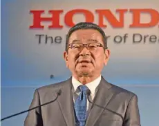  ?? — Reuters ?? Honda Motors President and CEO Takahiro Hachigo reacts during a press conference at the carmaker headquarte­rs in Tokyo.